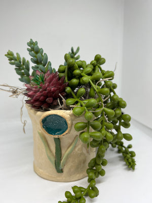 Pottery vase with succulents by Betty Jensen